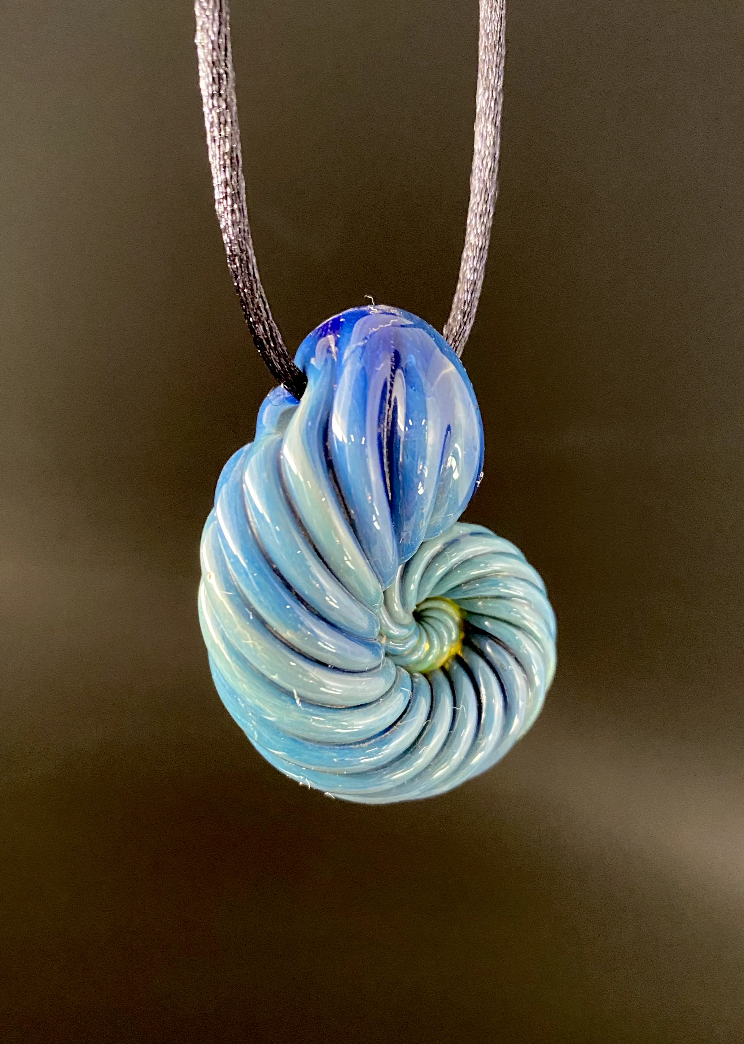 Ammonite pendant. (Deep sea)