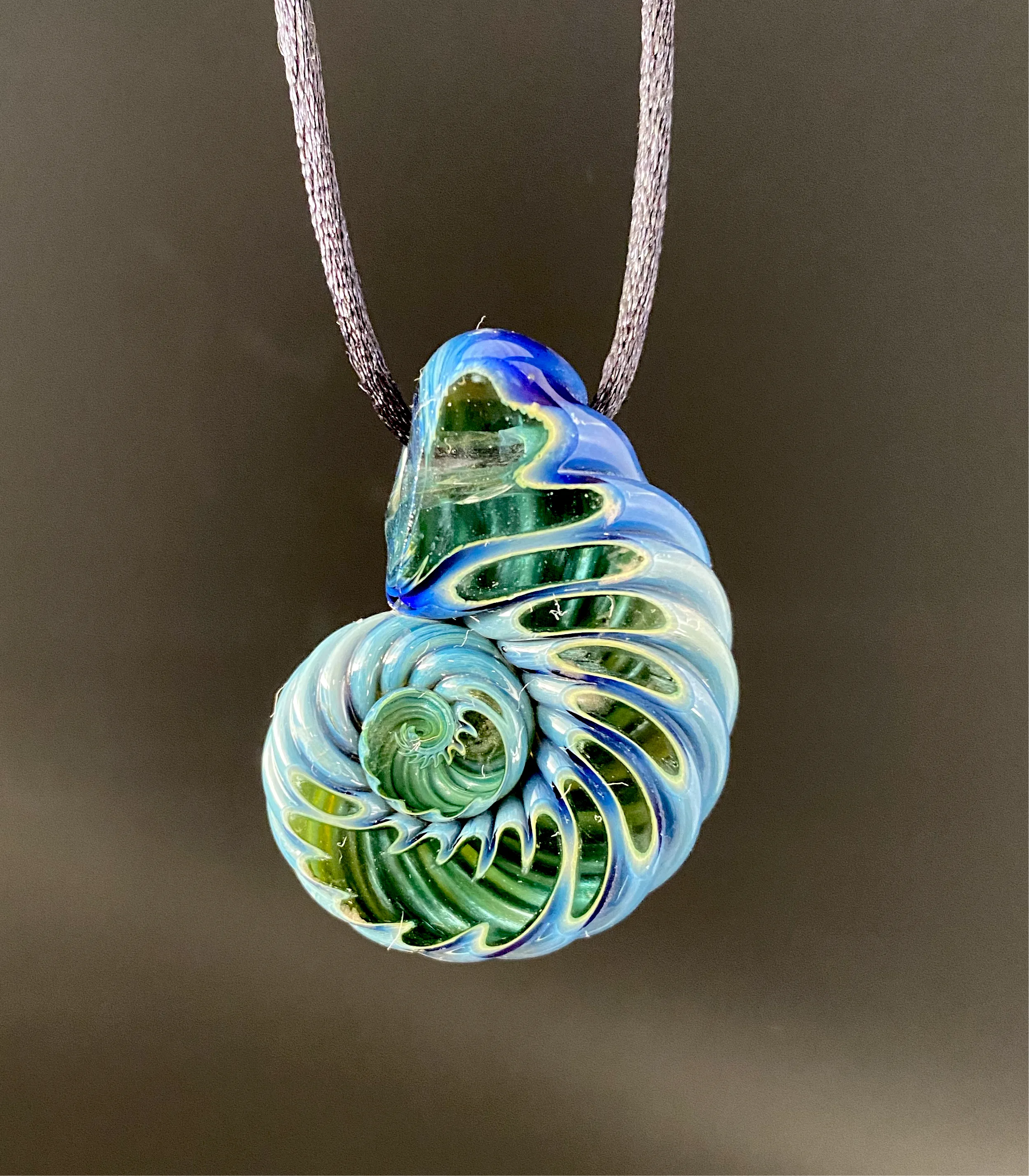 Ammonite pendant. (Deep sea)